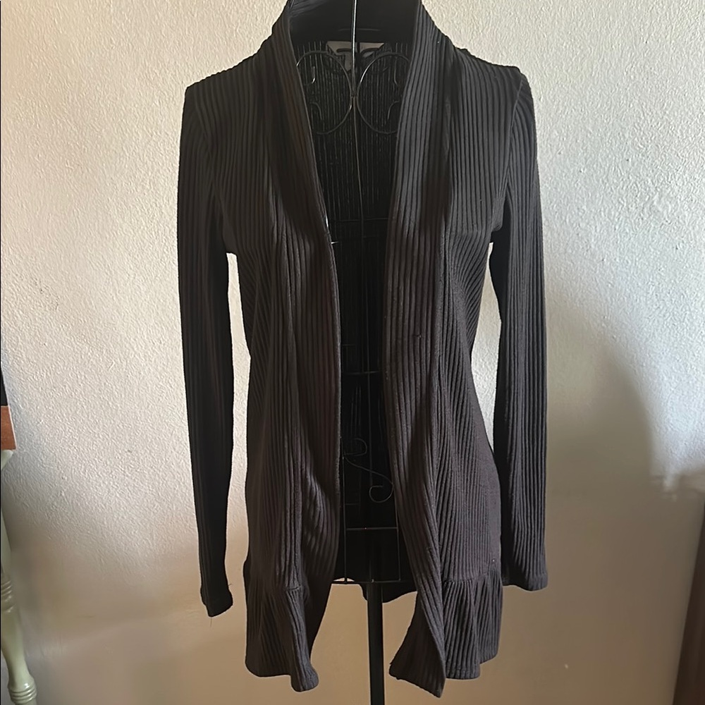 Black Ribbed Open Front Cardigan with Ruffle Bottom. - Picture 1 of 9